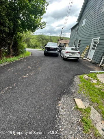 a view of street with parked cars