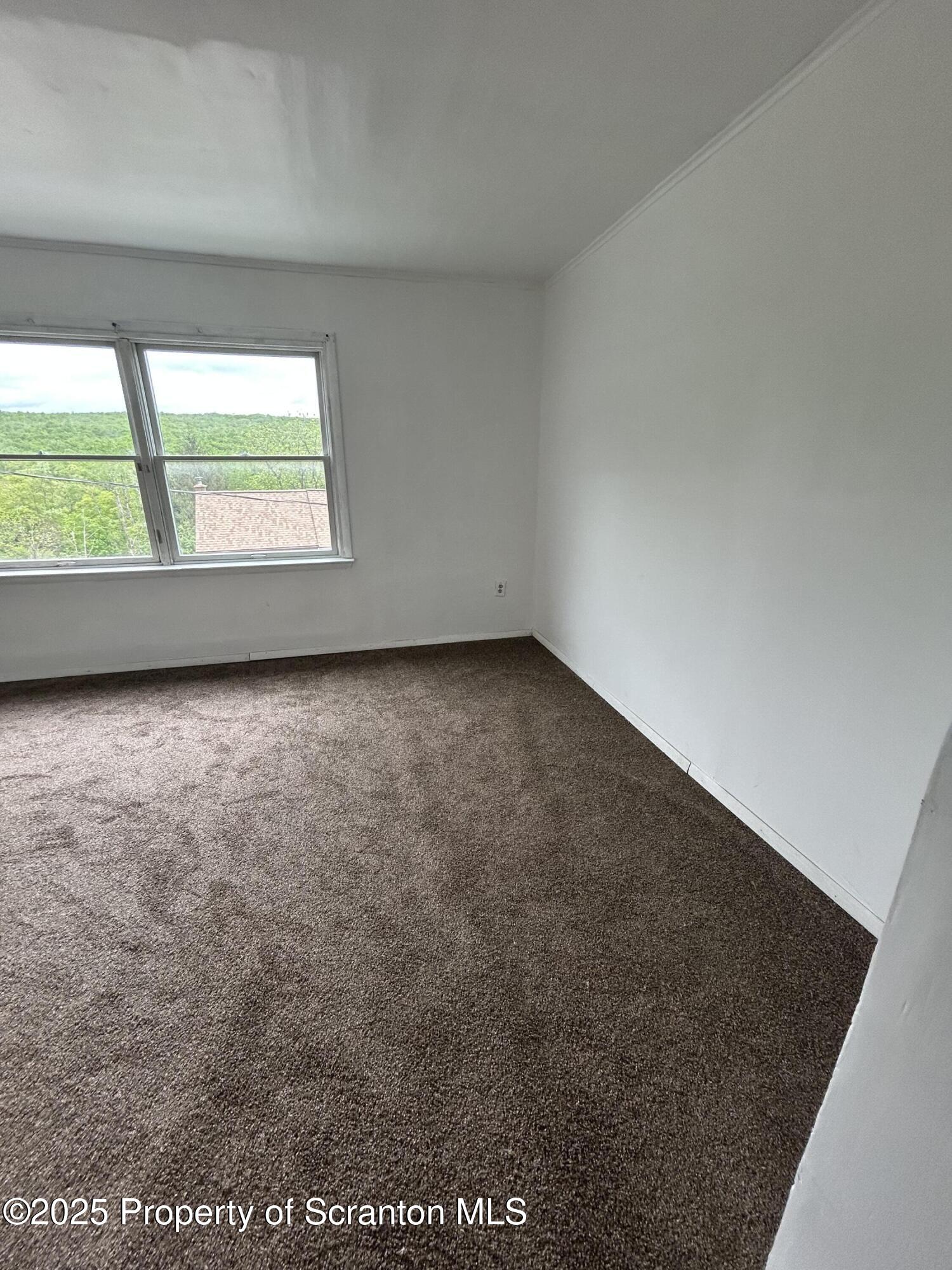 1177 North Main Street Forest City, PA 18421 - Photo 15 of 27 an empty room with a window
