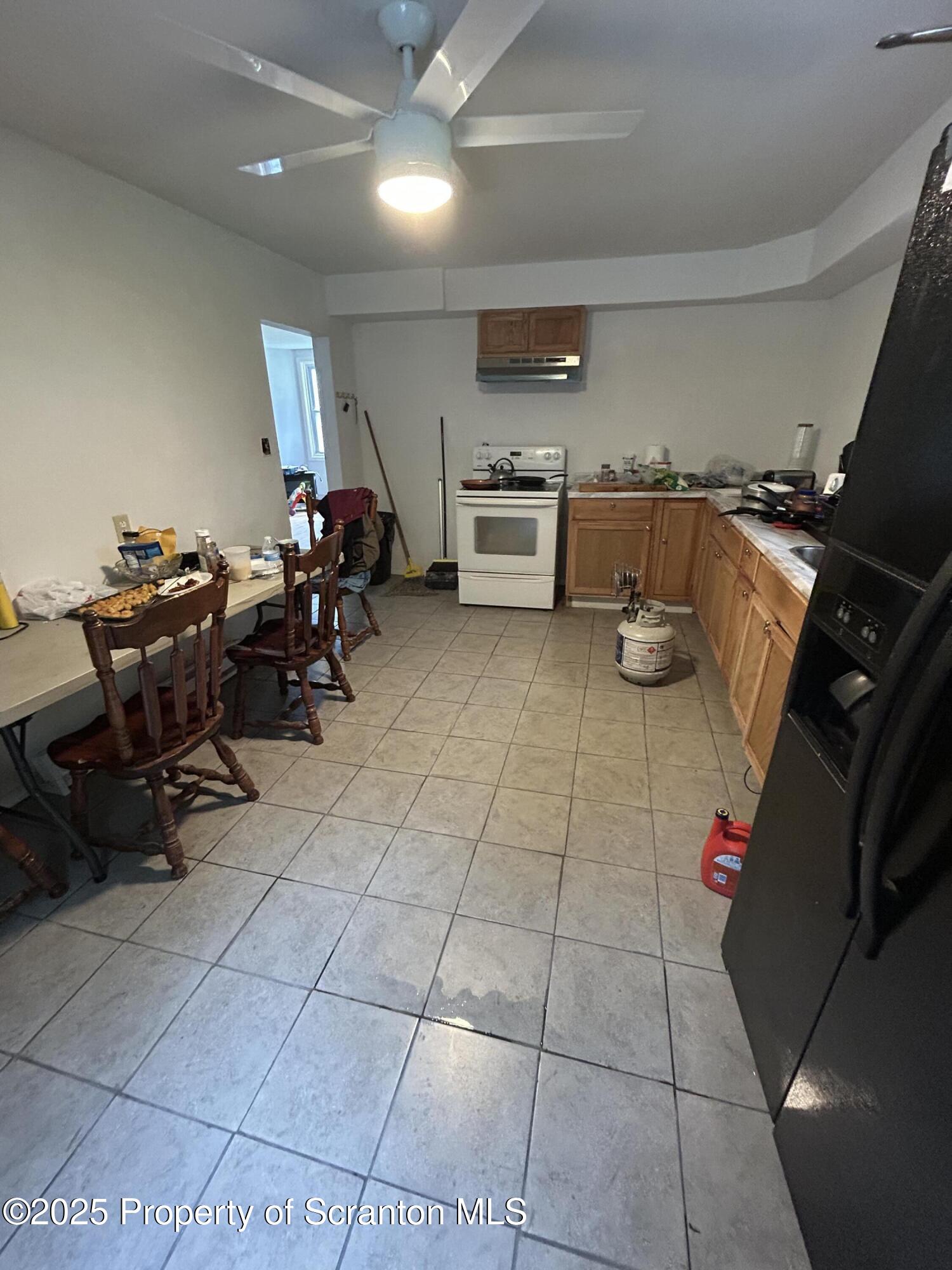 1177 North Main Street Forest City, PA 18421 - Photo 16 of 27 a living room with furniture and a gym machine