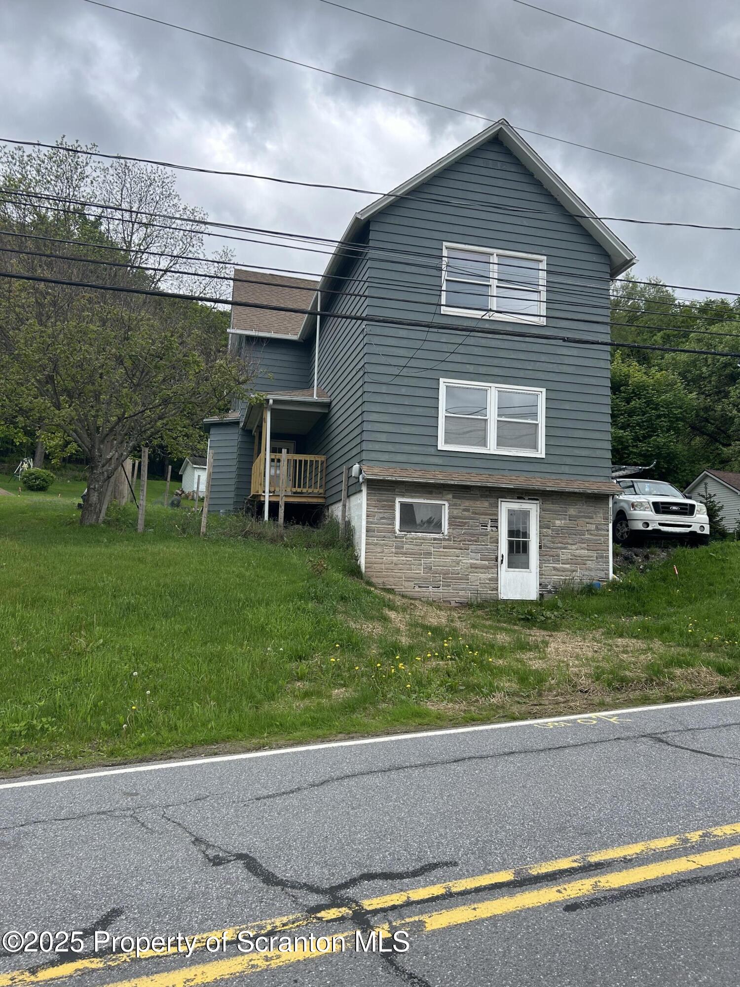 1177 North Main Street Forest City, PA 18421 - Photo 2 of 27 a front view of a house with a yard