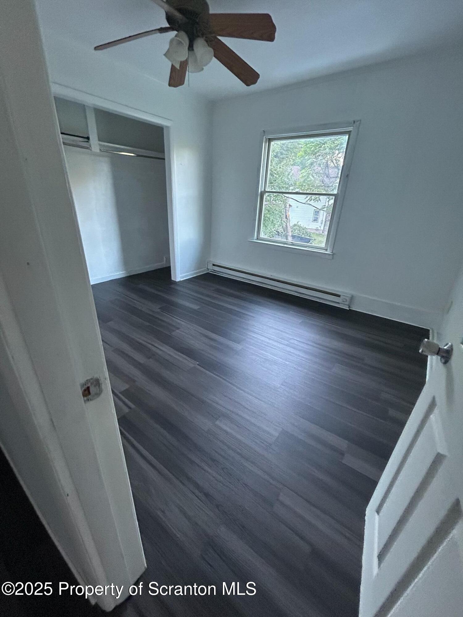 1177 North Main Street Forest City, PA 18421 - Photo 22 of 27 wooden floor in an empty room with a window
