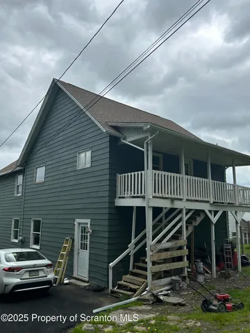 a view of a house with a deck