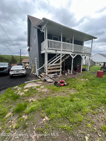 a view of a swimming pool with a yard