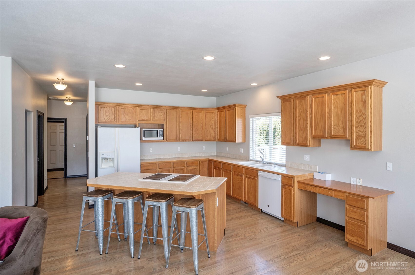 2229 Shay Court Buckley, WA 98321 - Photo 11 of 33 a kitchen with stainless steel appliances granite countertop a stove top oven a sink and a refrigerator