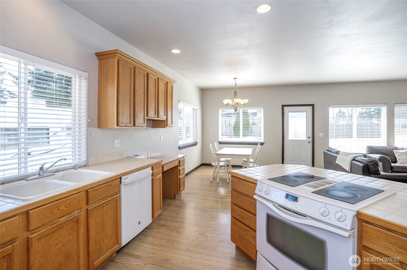 2229 Shay Court Buckley, WA 98321 - Photo 12 of 33 a kitchen that has a sink a stove and a wooden floor