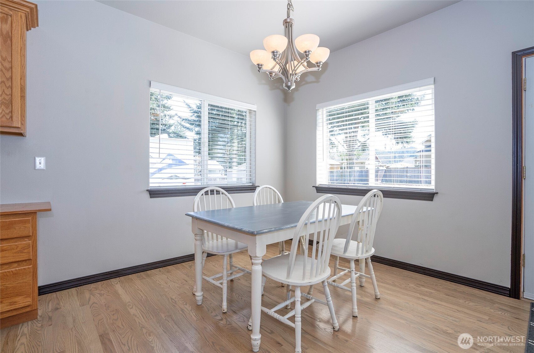 2229 Shay Court Buckley, WA 98321 - Photo 14 of 33 a dining room with chandelier and wooden floor