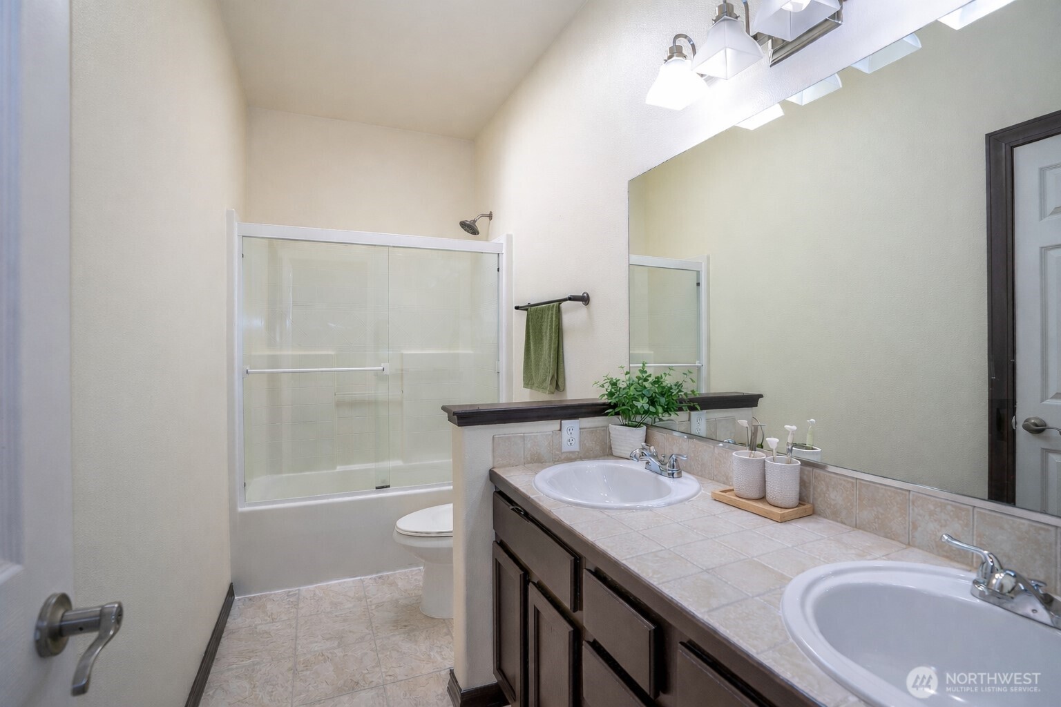 2229 Shay Court Buckley, WA 98321 - Photo 25 of 33 a bathroom with a granite countertop sink a toilet and shower