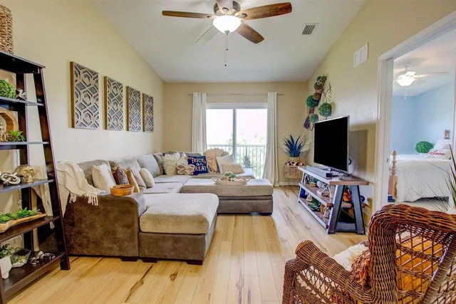 a living room with furniture and a table