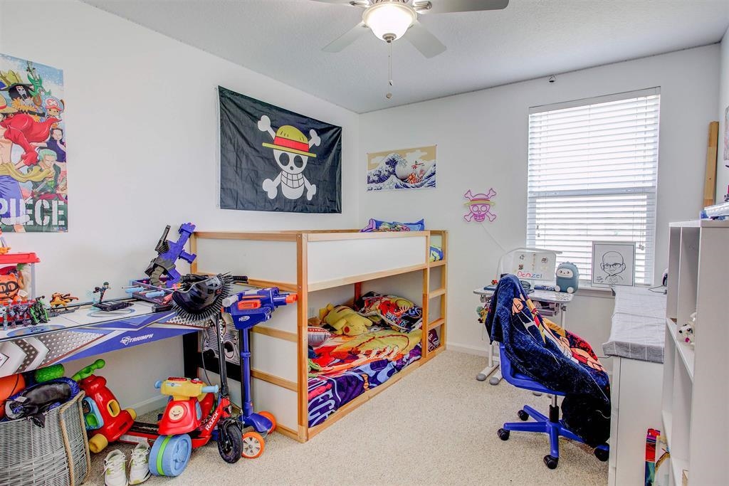 2344 Golden Lake Loop St. Augustine, FL 32084 - Photo 23 of 35 a play room with toys and a chandelier