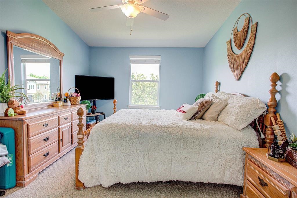 2344 Golden Lake Loop St. Augustine, FL 32084 - Photo 25 of 35 a bedroom with a bed and a flat screen tv