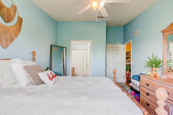 a bed room with a bed and a window