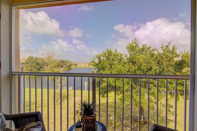 a view of a balcony with furniture