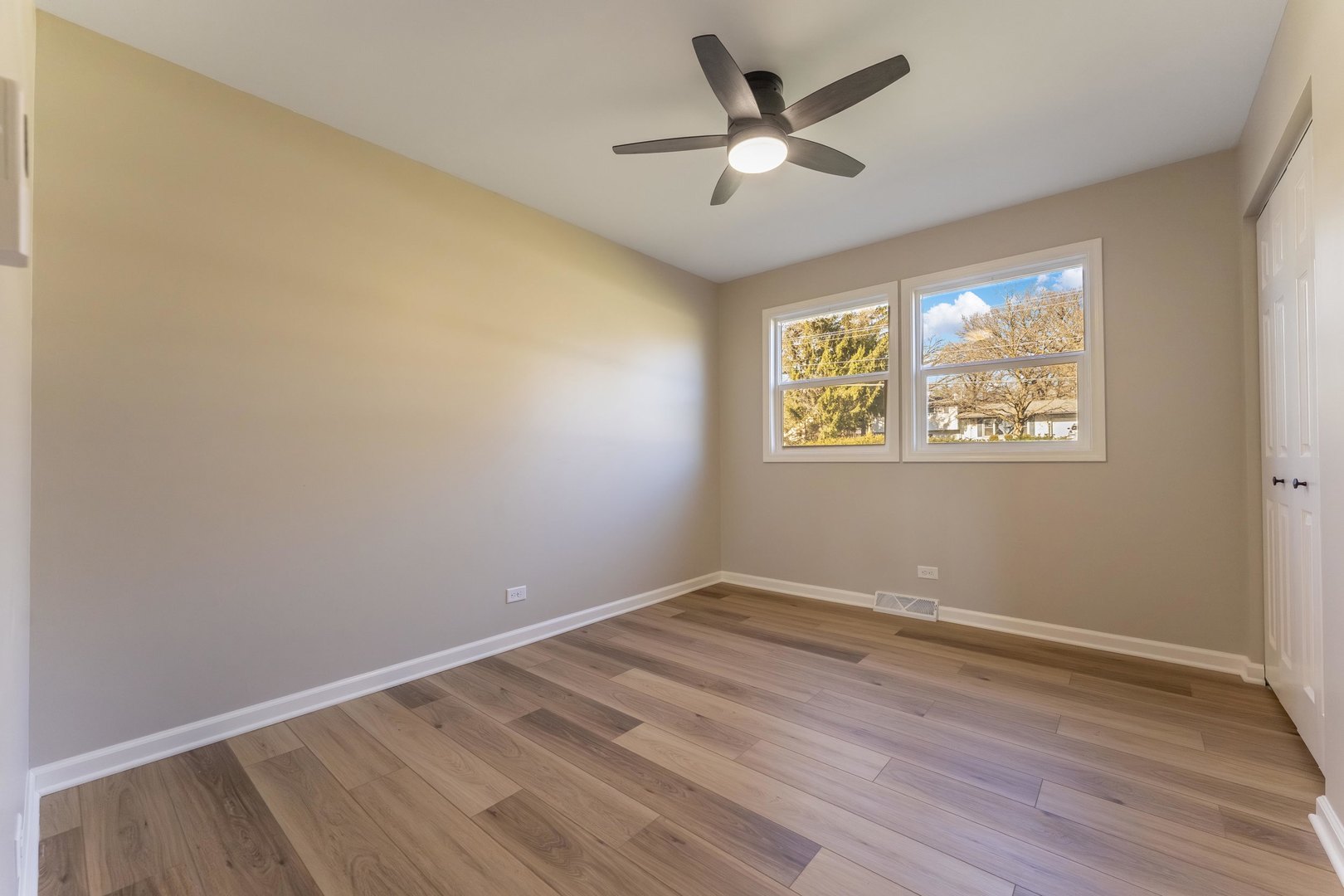 27-w073 Jewell Road Winfield, IL 60190 - Photo 14 of 34 a view of an empty room with wooden floor and a window
