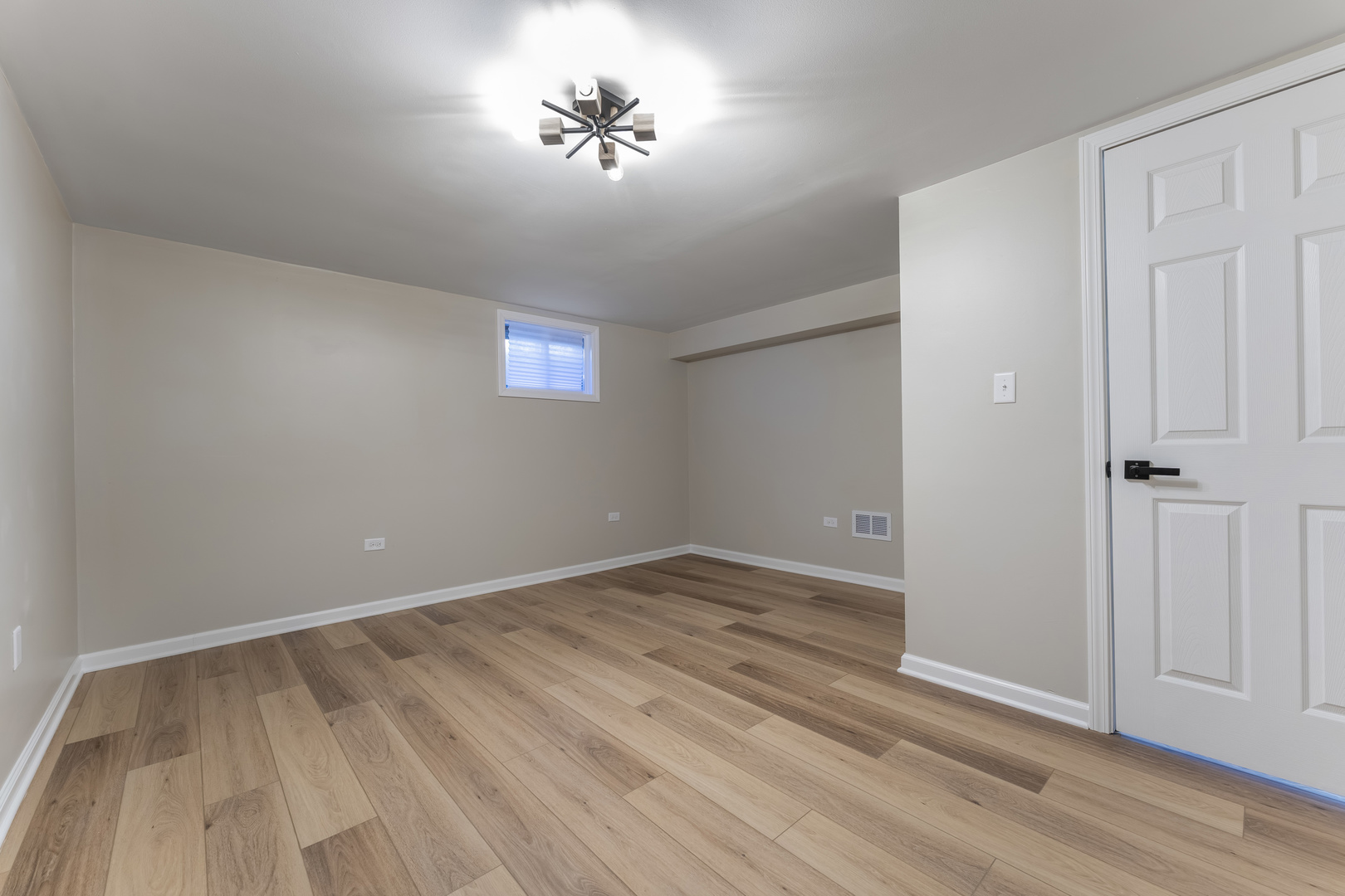 27-w073 Jewell Road Winfield, IL 60190 - Photo 21 of 34 wooden floor in an empty room with a window