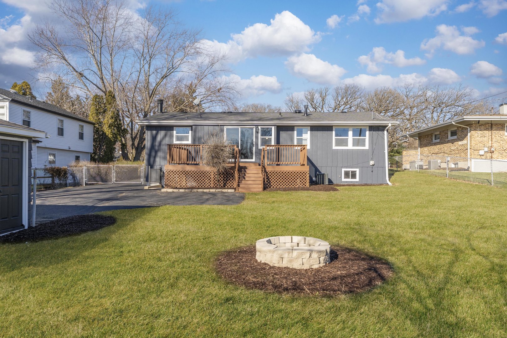 27-w073 Jewell Road Winfield, IL 60190 - Photo 26 of 34 a front view of a house with a garden and trees