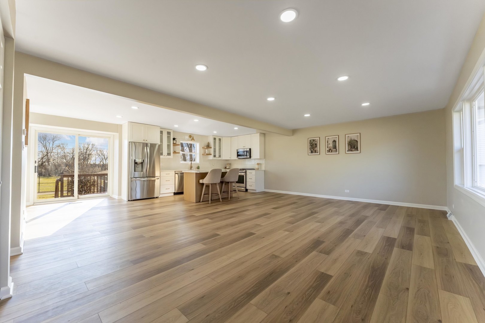 27-w073 Jewell Road Winfield, IL 60190 - Photo 8 of 34 an empty room with wooden floor and windows