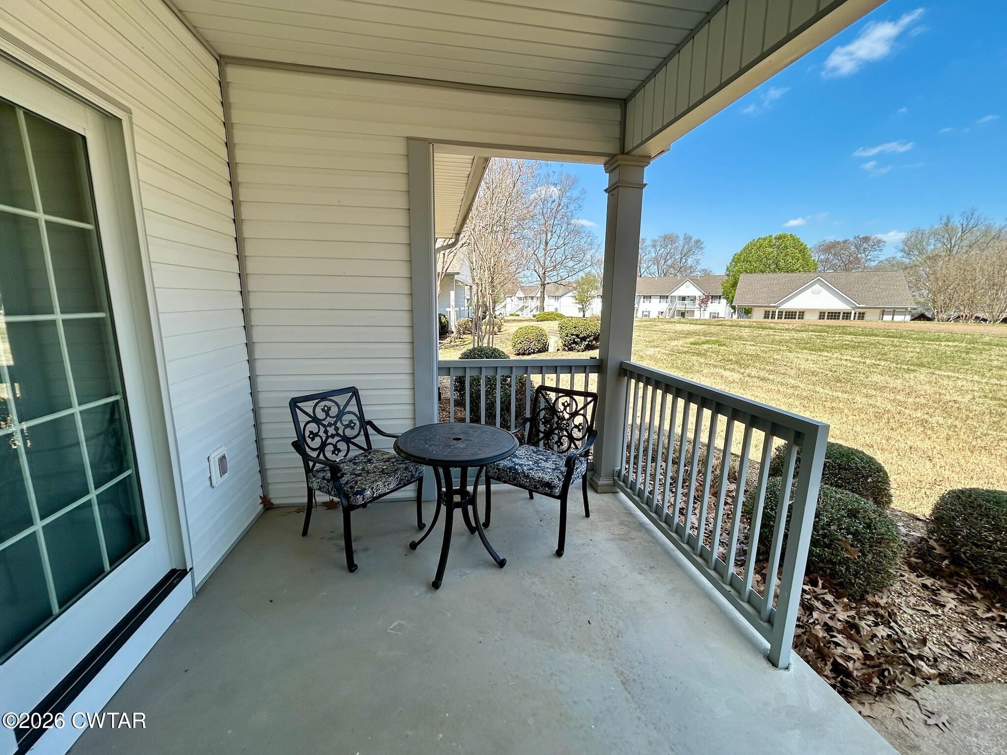 56 Pleasant Lane Springville, TN 38256 - Photo 19 of 20 a view of a balcony with furniture and floor to ceiling window