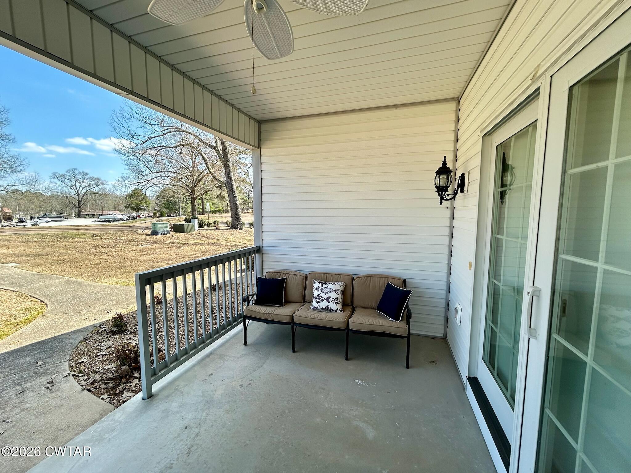 56 Pleasant Lane Springville, TN 38256 - Photo 20 of 20 a view of a porch with furniture and floor to ceiling window
