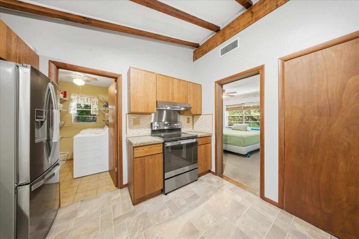 22 Stirrup Key Road Marathon, FL 33050 - Photo 15 of 48 a kitchen with a refrigerator and stove