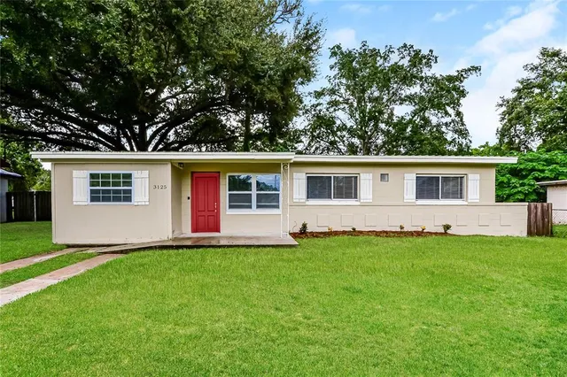 front view of a house with a yard