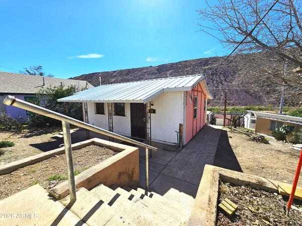 a view of a balcony with chairs