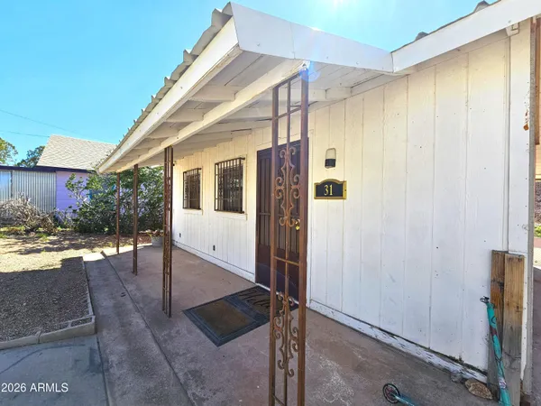 a view of a porch with wooden floor and entryway