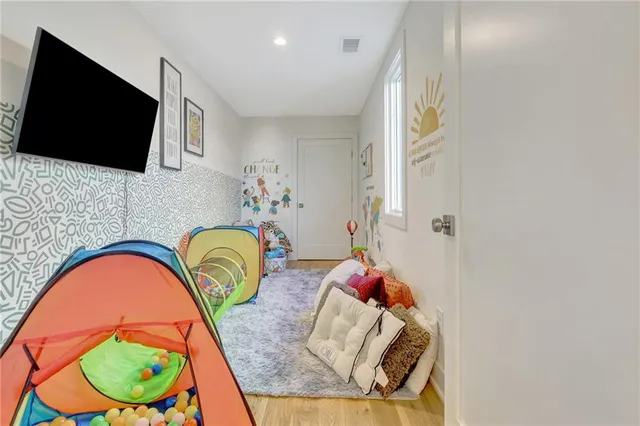 a kitchen with a table chairs and a stove