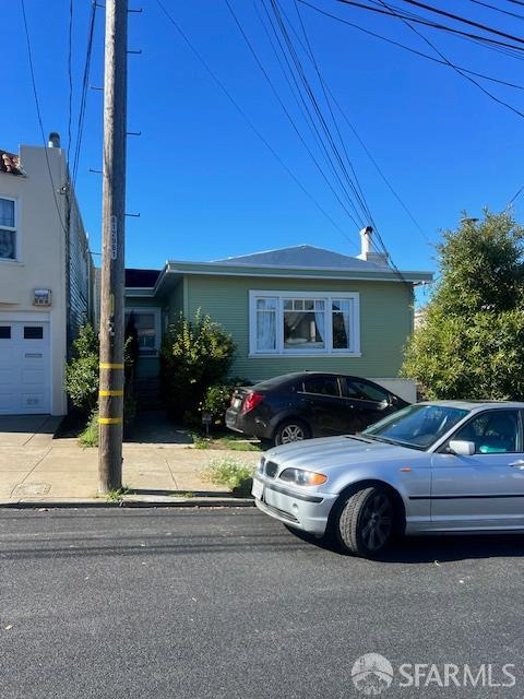 329 Faxon Avenue San Francisco, CA 94112 - Photo 4 of 6 a view of a car parked in front of a house