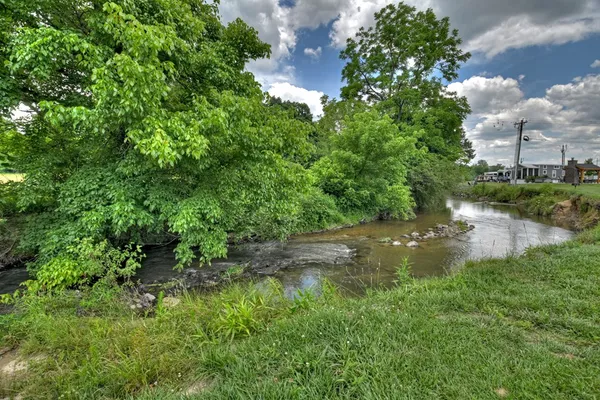 a view of a lake with a building in the background