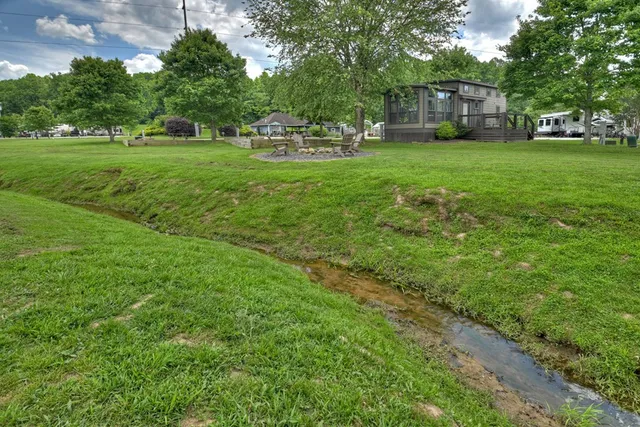 a view of a house with backyard
