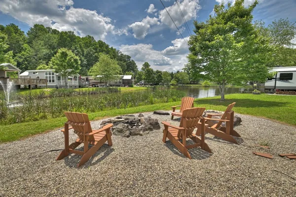 an outdoor sitting area with couch and wooden fence