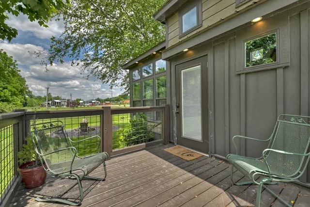 a balcony view with a seating space