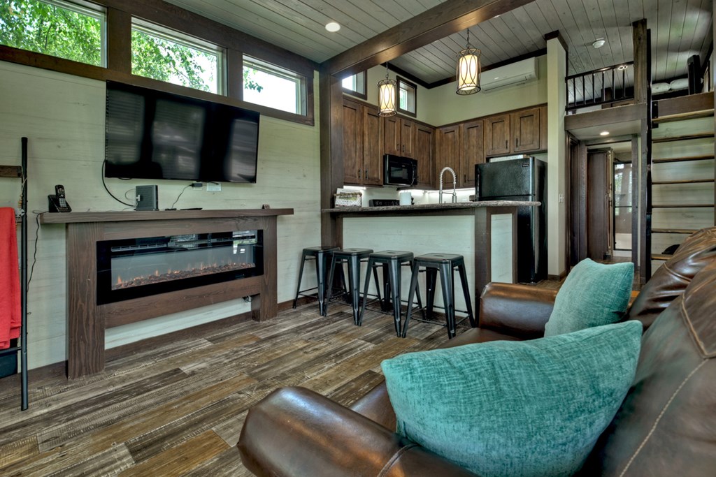35 Mountain Meadows Circle Morganton, GA 30560 - Photo 20 of 41 a living room with furniture a flat screen tv and a fireplace