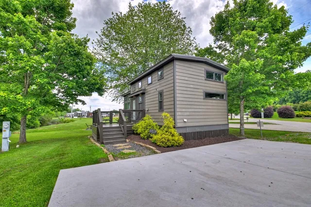 a view of a house with a yard and a garden
