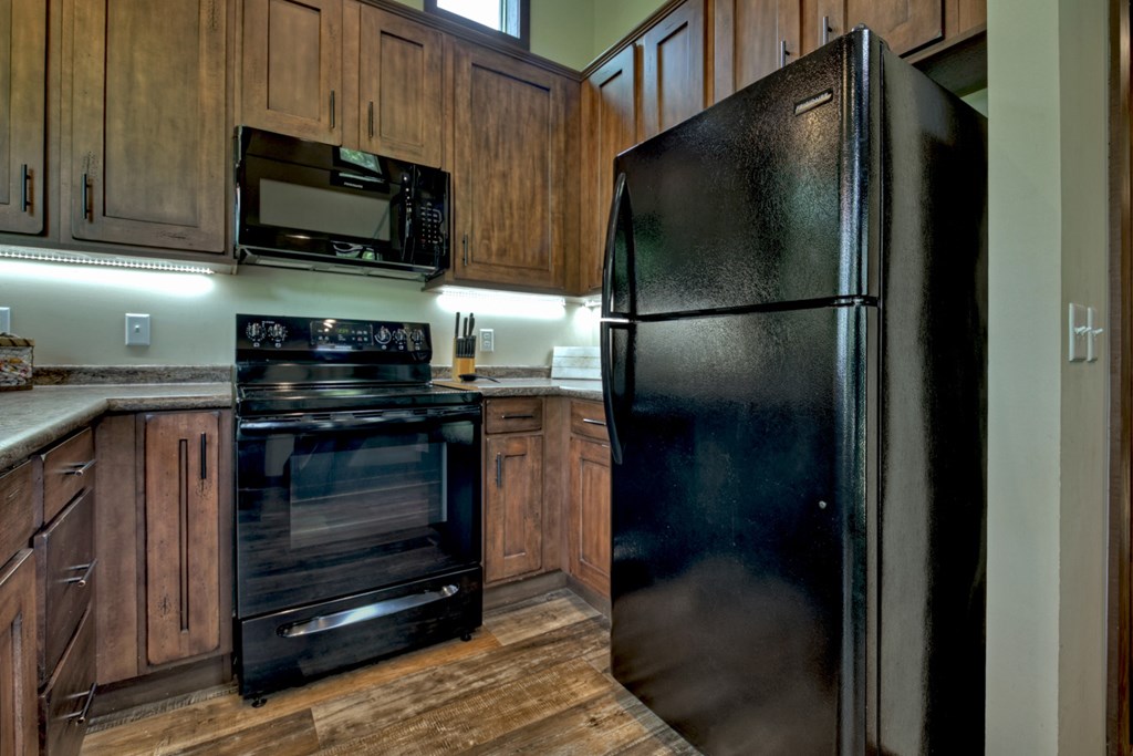 35 Mountain Meadows Circle Morganton, GA 30560 - Photo 23 of 41 a kitchen with a refrigerator stove and microwave