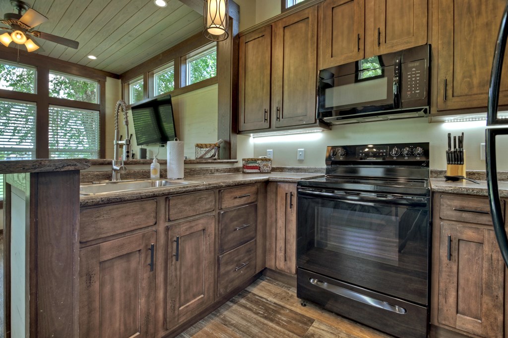 35 Mountain Meadows Circle Morganton, GA 30560 - Photo 24 of 41 a kitchen with stainless steel appliances a stove sink microwave and cabinets