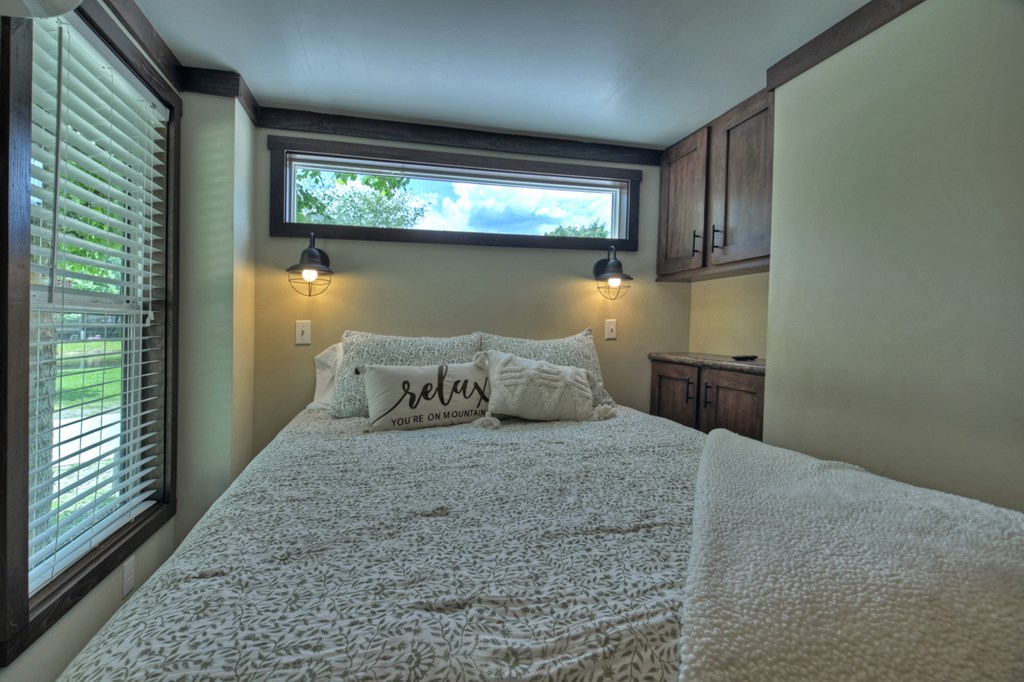 35 Mountain Meadows Circle Morganton, GA 30560 - Photo 26 of 41 a bed sitting in a bedroom next to a window