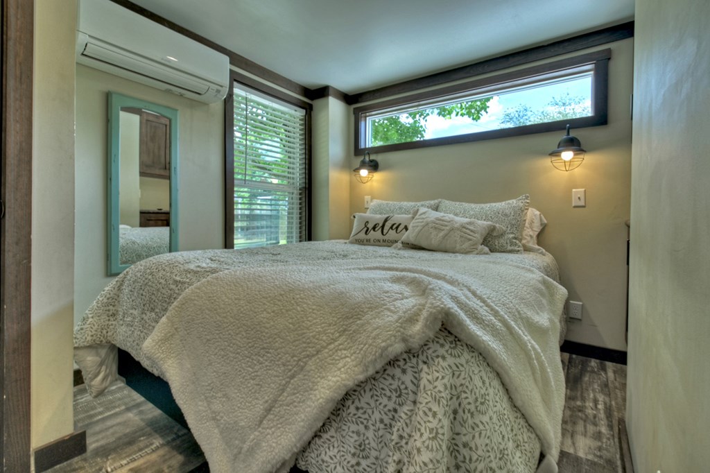 35 Mountain Meadows Circle Morganton, GA 30560 - Photo 28 of 41 a large bed sitting in a bedroom next to a window