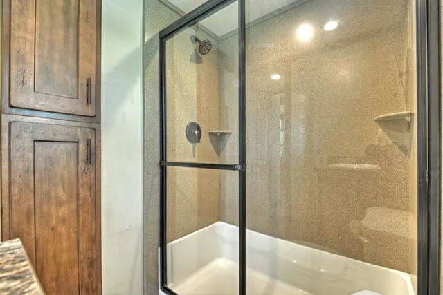 a bathroom with a shower and a tub