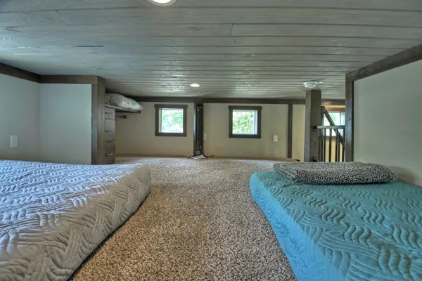 a bedroom with bed and window