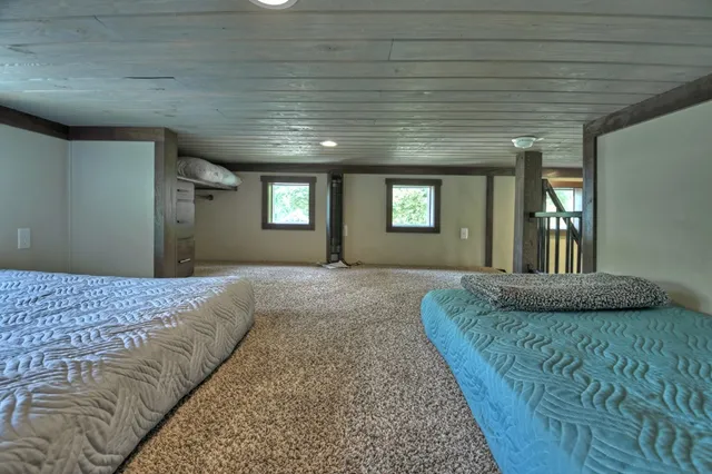 a bedroom with bed and window