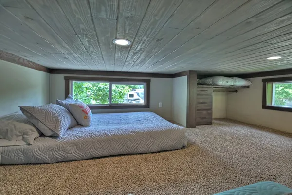 a bed room with a bed and a window