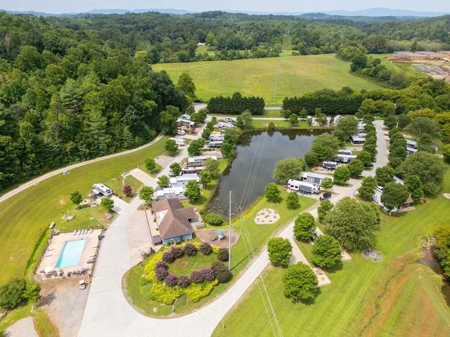 an aerial view of a house with a lake view