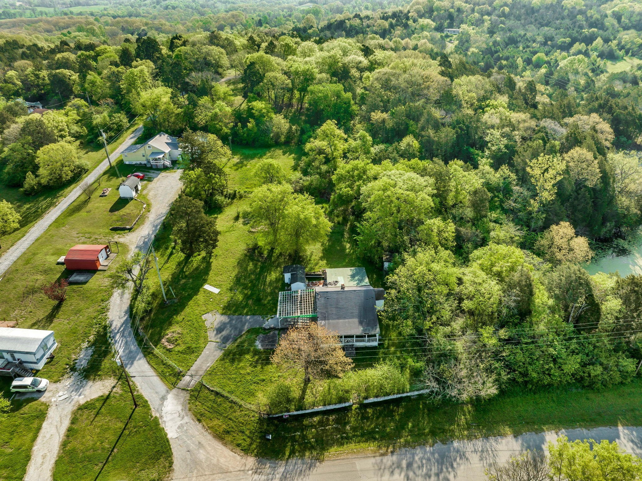 1810 Monsanto Road Columbia, TN 38401 - Photo 3 of 10 an aerial view of residential houses with outdoor space and trees