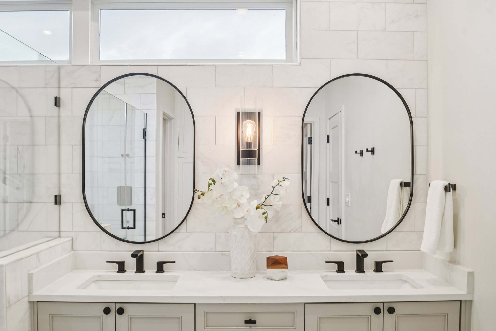 2518 Watkins Way Austin, TX 78746 - Photo 13 of 28 a bathroom with mirror and sink
