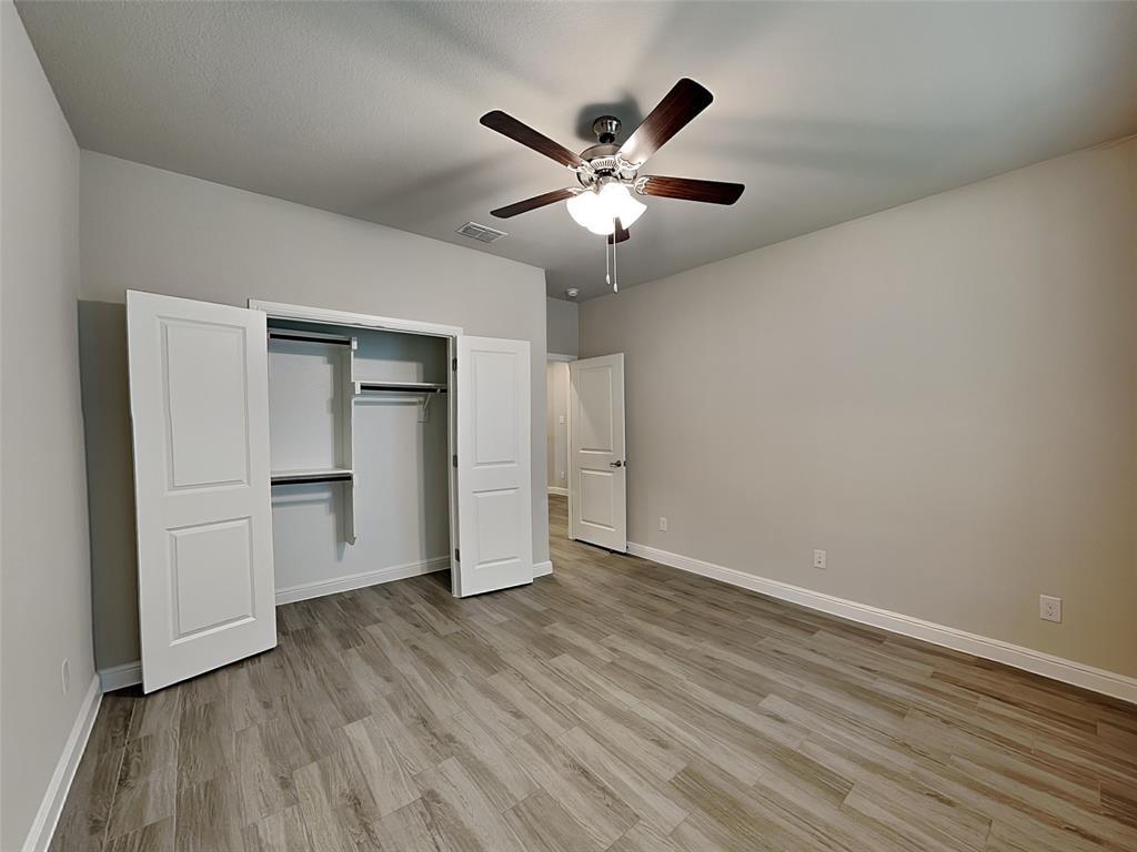 2344 Jack Rabbit Way Northlake, TX 76247 - Photo 11 of 17 a view of an empty room with wooden floor and closet