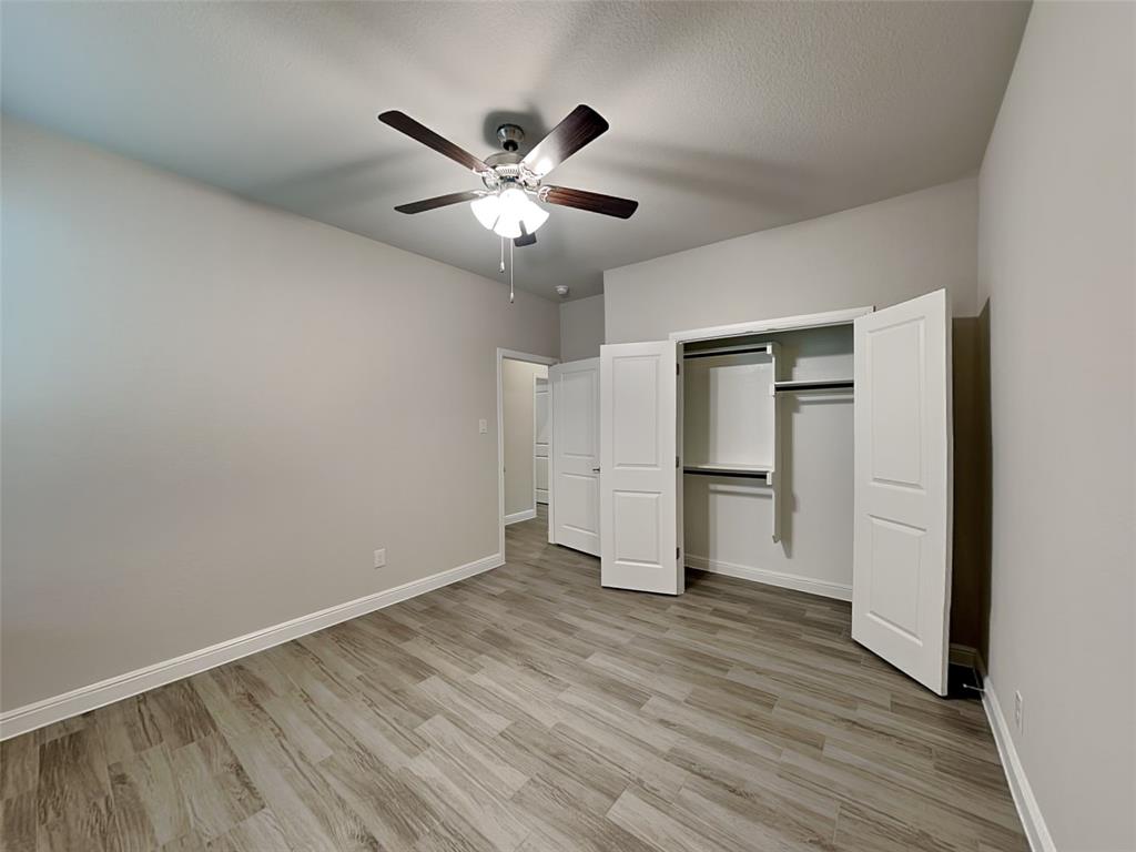 2344 Jack Rabbit Way Northlake, TX 76247 - Photo 12 of 17 a view of an empty room with wooden floor and window