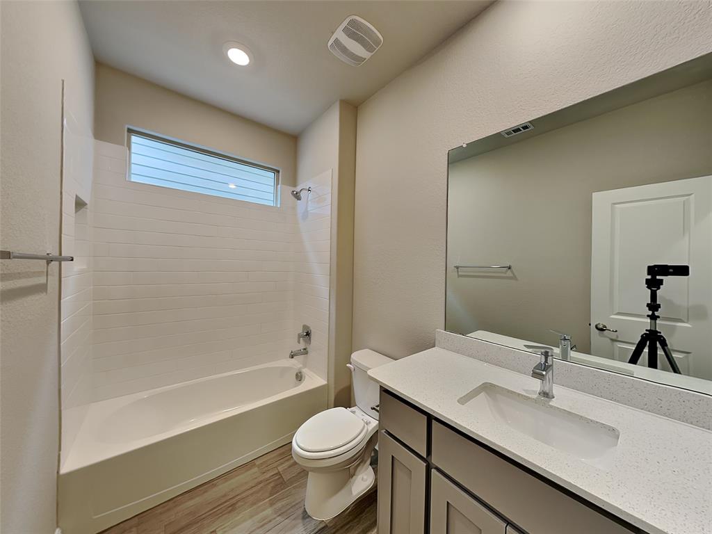 2344 Jack Rabbit Way Northlake, TX 76247 - Photo 15 of 17 a bathroom with a granite countertop sink toilet and shower