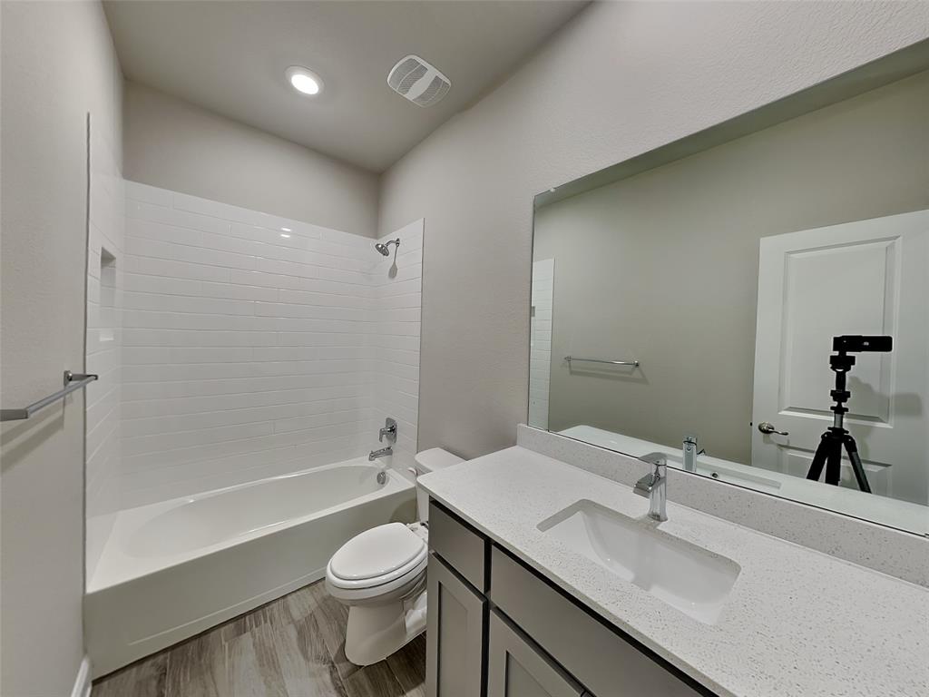 2344 Jack Rabbit Way Northlake, TX 76247 - Photo 16 of 17 a bathroom with a sink a toilet and shower