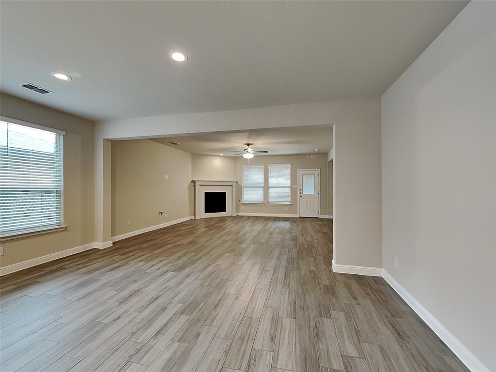 2344 Jack Rabbit Way Northlake, TX 76247 - Photo 5 of 17 wooden floor in an empty room with a window